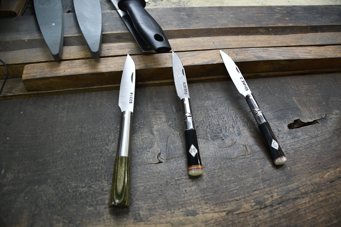 Handmade folding knives with custom handles