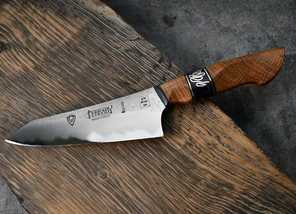 Handmade kitchen knife with welsh oak handle made by Will Ferraby. 