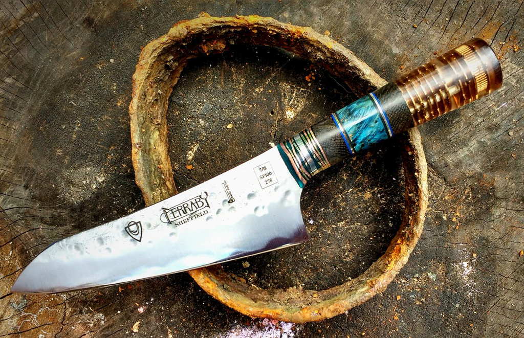 Handmade kitchen knife with unique composite handle with grandfather clock cogs made by artisan knife maker Ferraby Knives. 
