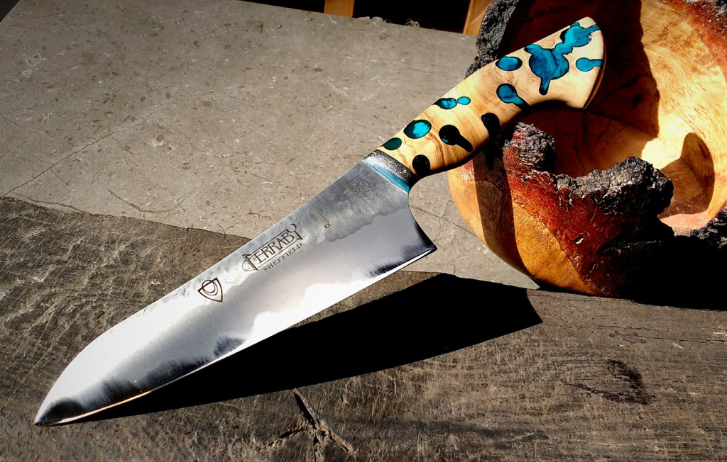 Hand crafted Santoku made in Sheffield by Will Ferraby. Handle inspired by the bow drill. 